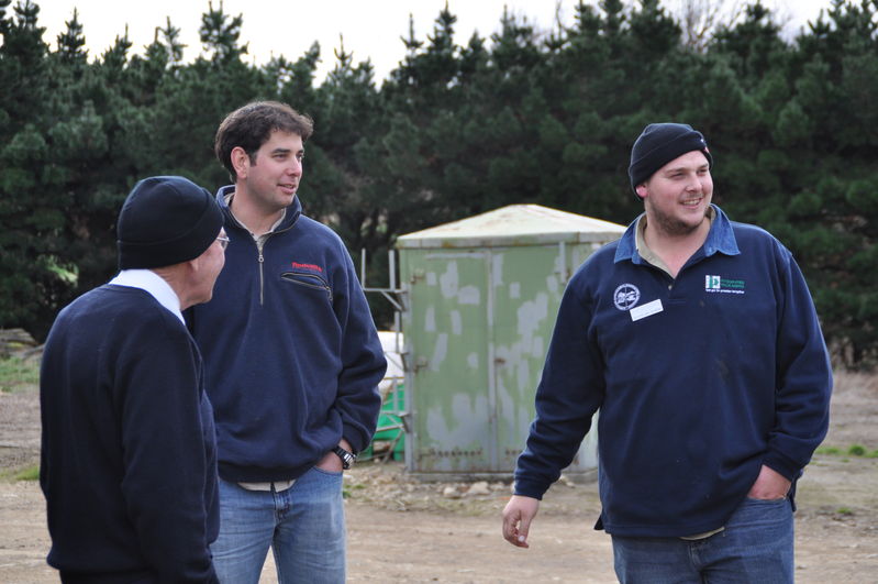 Farm tour on the Canterbury Plains. Coach Captain (Reverend John) Lyndsay Zanker and Justin Richards. (Gun storage cabinet in background)